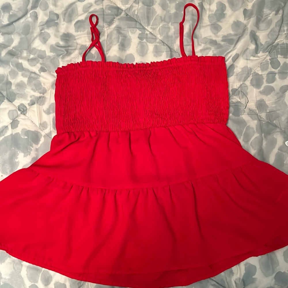 red tank top. slightly cropped very gooey on the bottom
